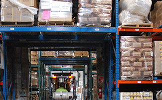 filled warehouse shelves with shipment packages